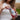Woman holding a package of Cocoa Craze Sattva Vida Energy Bite 2pack
